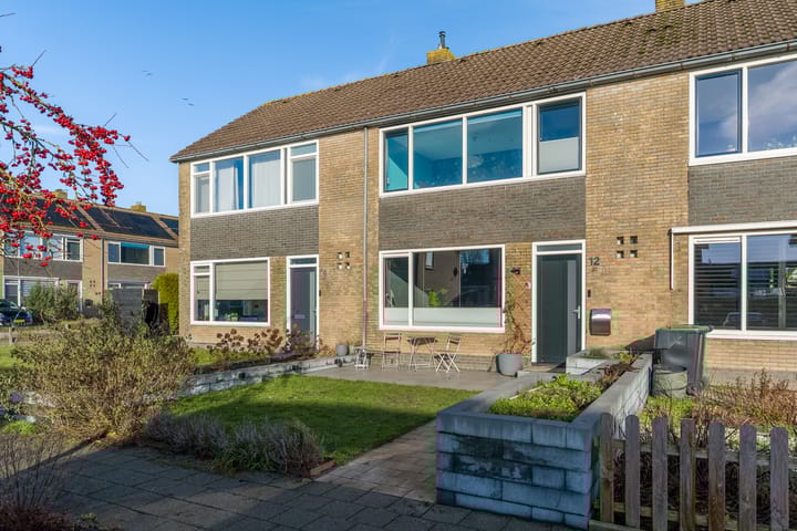 Photo of property Kerkstraat 12, Munnekezijl