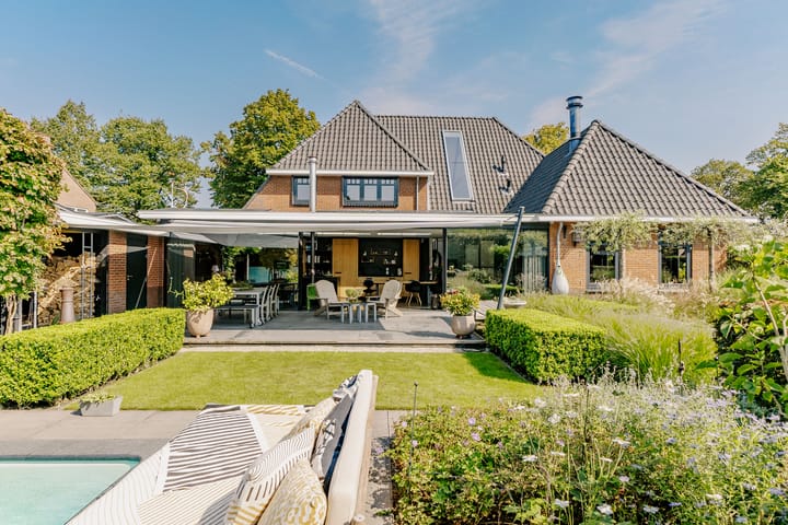 Photo of property De Ruyterstraat 9, Huizen