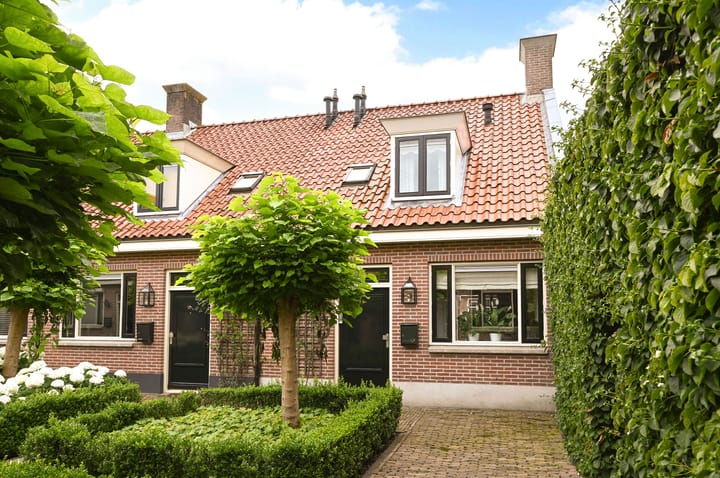 Photo of property Doolhofje 1, Huizen